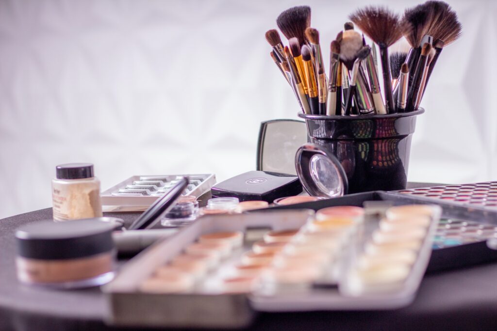 Close-up of various makeup tools, illustrating the essential items for achieving a flawless makeup look for a first date