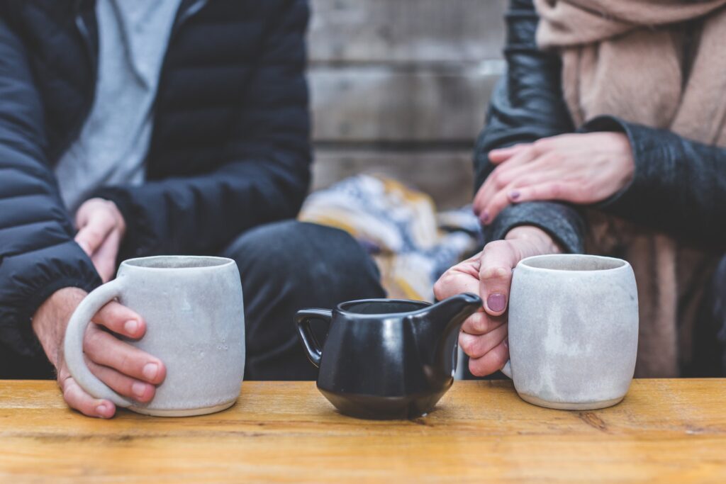 Couple having coffee, demonstrating the intimacy of a casual date in person